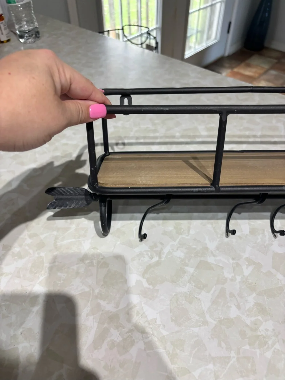 Rustic Black Metal Wall Shelf with Hooks and Wood Accent